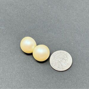 Pair of small pearlized stud earrings.